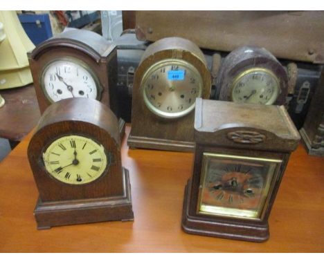 Mixed mantel clocks to include an early 20th century oak cased clock having a silvered dial with Roman numerals 10"h 