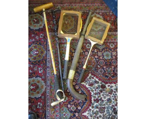 A selection of vintage games, rackets and sticks together with an African tribal walking stick 