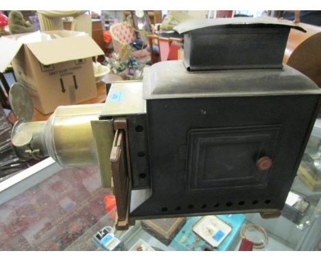 A late Victorian/early 20th century brass and tin cased magic lantern 