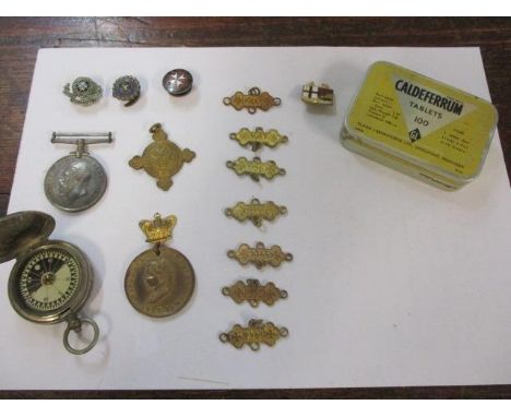 A St John's Ambulance enamelled pin badge, a military compass, a George V medal and others 