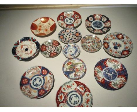 A collection of oriental plates to include Imari examples 