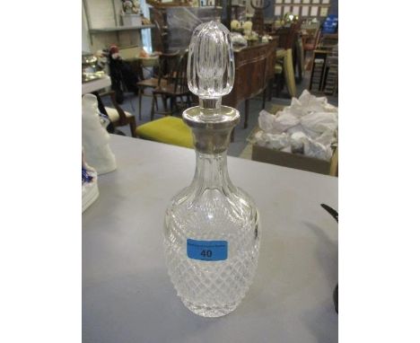 A silver collared, cut glass decanter, 12"h 
