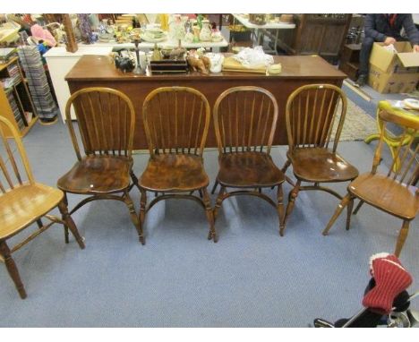 A set of four Windsor stick back chairs with crinoline stretchers and turned legs, a similar chair with H-stretchers, and an 