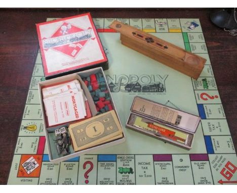 A vintage Monopoly, with six metal pieces, an Echoluxe harmonica and an inlaid wooden pencil box 