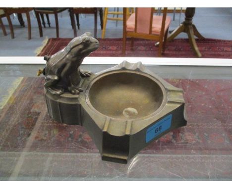 An early 20th century spelter ashtray with a cigar lighter in the form of a frog 