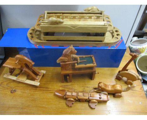 Six new articulated wooden toys to include Trap Door, a bear playing pool, a rocking horse, a crocodile, a cat and a bird 