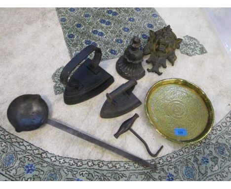 Metalware to include a wrought iron ladle, a boot jack, two flat irons, a lion mask furniture mount and other items 
