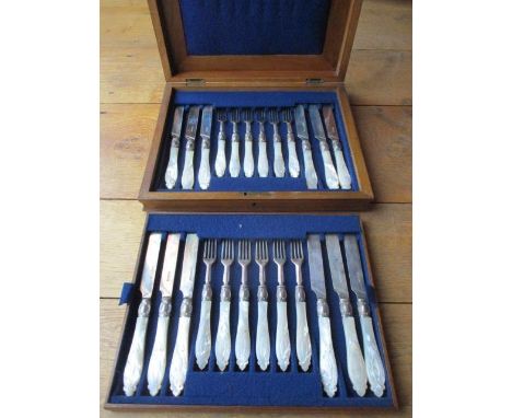 A set of twelve mother of pearl and silver plated knives and forks 