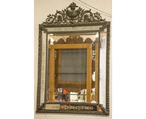 WALL MIRROR, Napoleon III patinated metal with urn crest above an etched cushion frame with bevelled rectangular centre plate