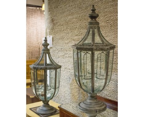 STORM LANTERNS, a pair, with a turned finial and a glazed top and side panels, 72cm H. (2)