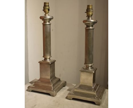 LAMP BASES, a pair, silvered metal each with reeded columns and stepped plinth bases, 44cm H x 16cm W. (2)