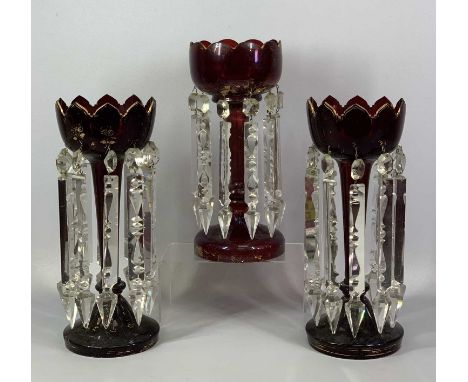 VICTORIAN RUBY GLASS LUSTRES A PAIR, with gilded highlights and clear cut glass drops, 34.5cms (h) and a similar single lustr