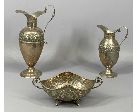 CYPRIOT SILVER GROUP OF THREE ITEMS, two pitchers and an oval two handled bowl, repousse decoration, the larger pitcher 24.5c