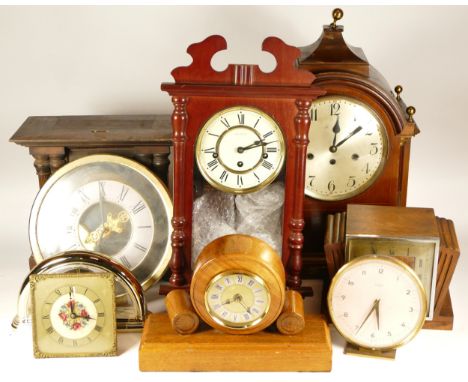 A collection of mid 20th century and later mantel clocks, wall clocks and carriage clocks, having manual wind and quartz move