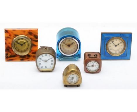 Six assorted clocks to include a 1930s enamel and brass cased clock, the silvered dial with black Arabic numerals, together w