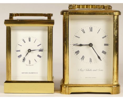 A 20th century German Augustus Schata &amp; Sons brass and four glass corniche cased mantle clock, the white dial with black 