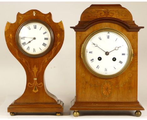 A late 19th century French inlaid mahogany mantel clock, having an eight day movement striking on gong, 29cm tall, together w
