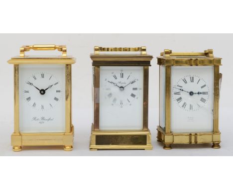 A 20th century Rowell of Oxford French brass and four glass corniche cased serpentine front carriage clock, the white dial wi