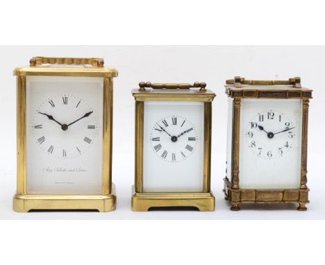 A 20th century Augustus Schatz and Sons West German brass and four glass corniche cased carriage clock, the white dial with b