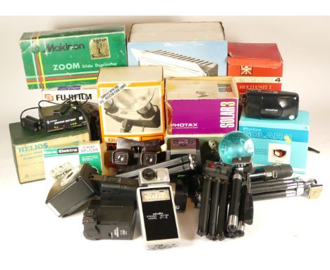 Assortment of camera accessories and lighting equipment