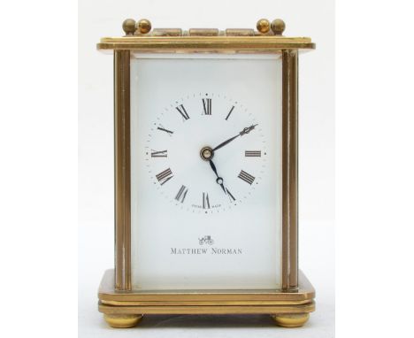 A 20th century Matthew Norman brass and four glass corniche cased carriage clock, the white dial with black Roman numerals, r