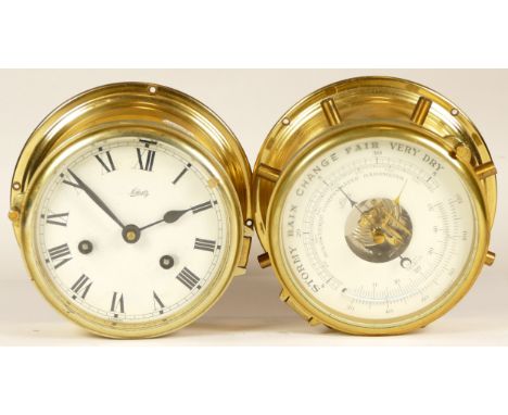 A German Schatz brass bulkhead clock, the eight day movement striking on bell, 17cm diameter, together with a Schatz bulkhead