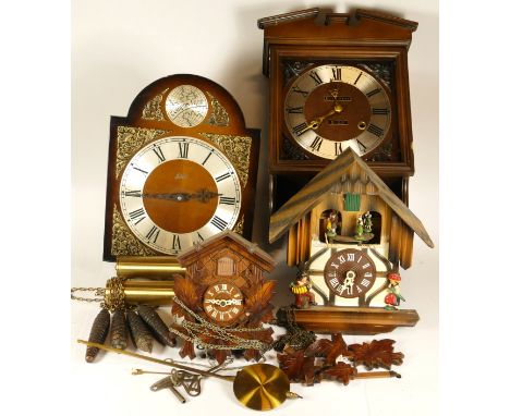 A collection of mid 20th century wall clocks together with cuckoo clocks, having manual wind movements. (2) 
