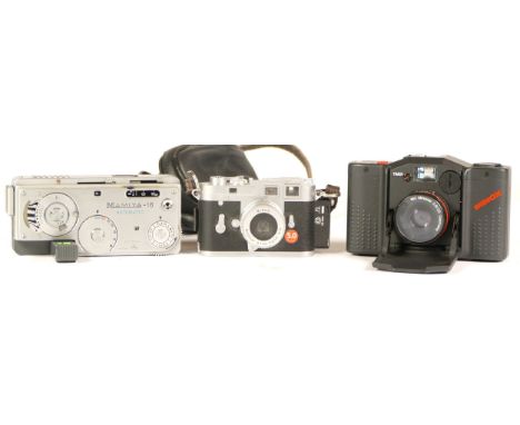 A Minox Leica MC Plus camera, together with various accessories