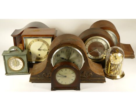 A collection of mid 20th century and later mantel clocks, wall clocks and carriage clocks, having manual wind and quartz move