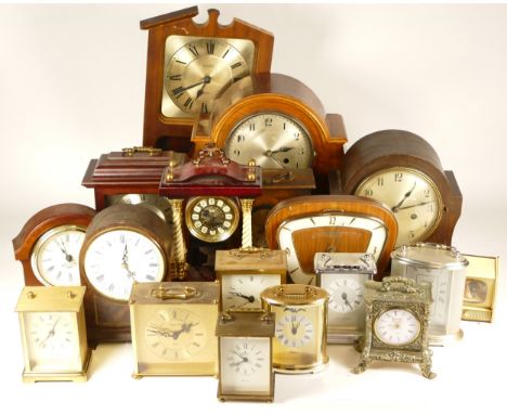 A collection of early 20th century and later mantel clocks, anniversary clocks, desk clocks and carriage clocks, having manua