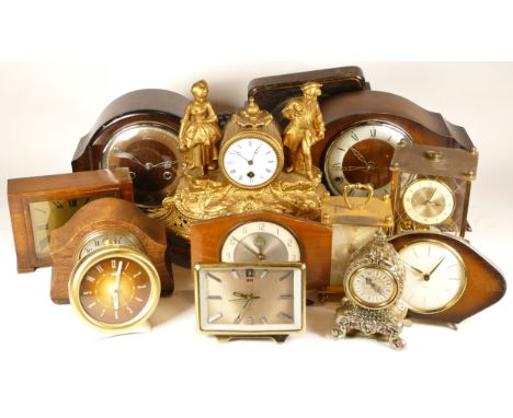 A collection of mid 20th century and later mantel clocks, anniversary clocks and carriage clocks, having manual wind and quar