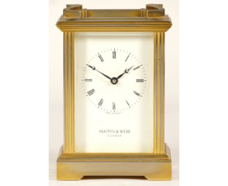 An English brass carriage clock, enamelled dial wit roman numerals, having an eight day jewelled movement, stamped made in En