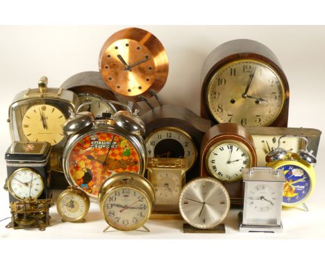 A collection of mid 20th century and later mantel clocks, wall clocks and traveling alarm clocks, having manual wind and quar