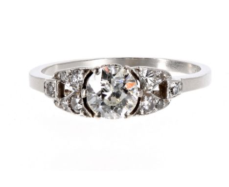 Attractive platinum diamond set ring, with central diamond 0.60ct approx, clarity SI, colour H/J, in a open setting with furt