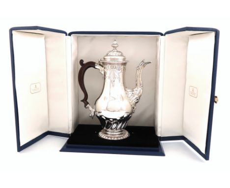 A George II silver coffee pot, by Samuel Courtauld I, London 1757, baluster form, embossed scroll and fluted decoration, leaf