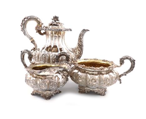 λA three-piece George IV silver coffee set, by Emes and Barnard, London 1828, lobed baluster form, chased foliate decoration,