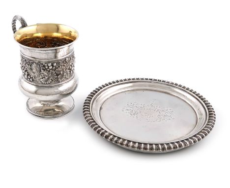 A George III silver coffee pot stand, by William Eaton, London 1813, circular form, gadroon border, the centre with an armori