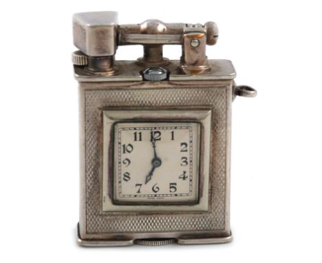 Please note: this lot does not have a winder.A Parker Beacon (Dunhill) electroplated watch lighter, inscribed 'Beacon/Parker'