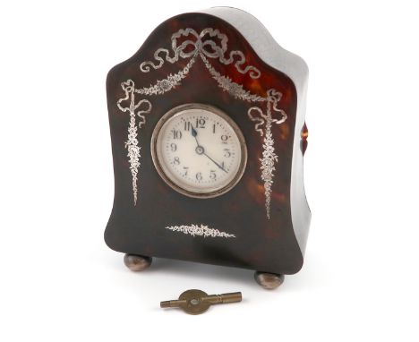 λAn Edwardian silver-mounted tortoiseshell mantle clock, probably by Hatil Arnold, London 1906, shaped and arched upright rec