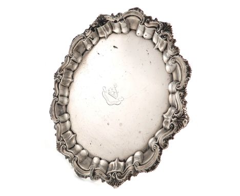 A Victorian silver salver, by The Barker Brothers, Birmingham 1898, circular form, shell and scroll border, the centre with a