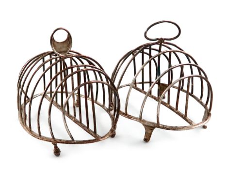 A George III silver seven-bar toast rack, by Henry Green, London 1793, oval form, wire-work bars, with a central carrying han