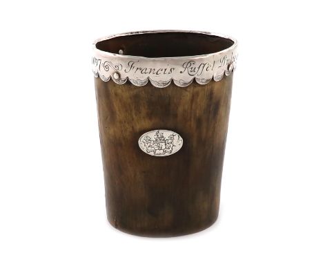 A late 17th century silver-mounted horn beaker, unmarked circa 1697, tapering circular form, the silver mount with an engrave