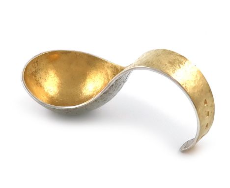 By Malcolm Appleby, a modern Scottish parcel-gilt Britannia standard silver caddy spoon, Edinburgh 2009, spot-hammered oval b