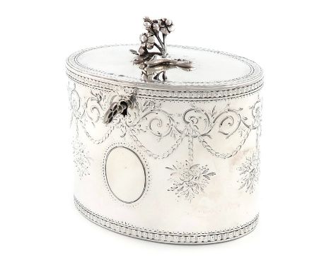 A George III silver tea caddy, by Aaron Lestourgeon, London 1772, oval form, engraved foliate decoration, the flush-hinged co