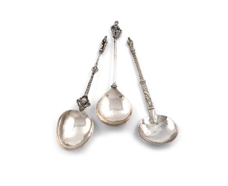 A small collection of three continental silver spoons, comprising: a Dutch spoon, 1910, with a figural terminal, length 18cm,