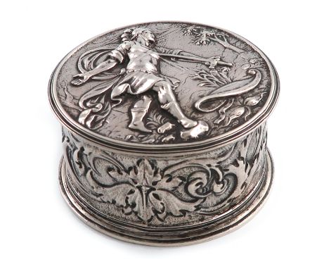 A late 17th century silver dressing table box, unmarked, circa 1680, circular form, the pull-off cover with an embossed relie