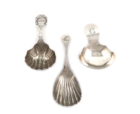 A small collection of three antique Irish silver caddy spoons, one by Samuel Neville, Dublin 1817, slender shell bowl, creste