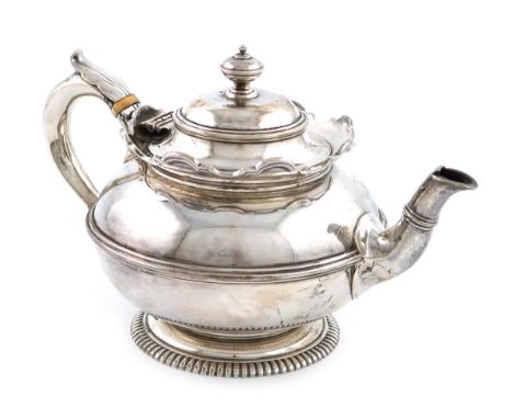 λA silver bachelor's teapot, by Sebastian Garrard, London 1926, circular form, leaf capped scroll handle with ivory insulator