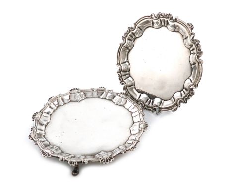 A George III silver waiter, by Ebenezer Coker, London 1760, circular form, shell and scroll border, on three hoof feet, diame