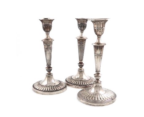 A pair of late-Victorian silver candlesticks, by Holland, Aldwinckle &amp; Slater, London 1897, in the Adam style, fluted tap